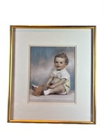 A Framed Child Portrait 23.25H x 20.75W x 2D