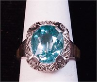 A woman's white gold ring marked 14K with spinel
