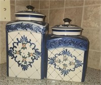 Two blue ceramic cannisters with lids