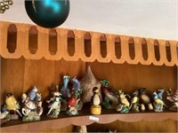 Top shelf of bird figurines plus wades as found