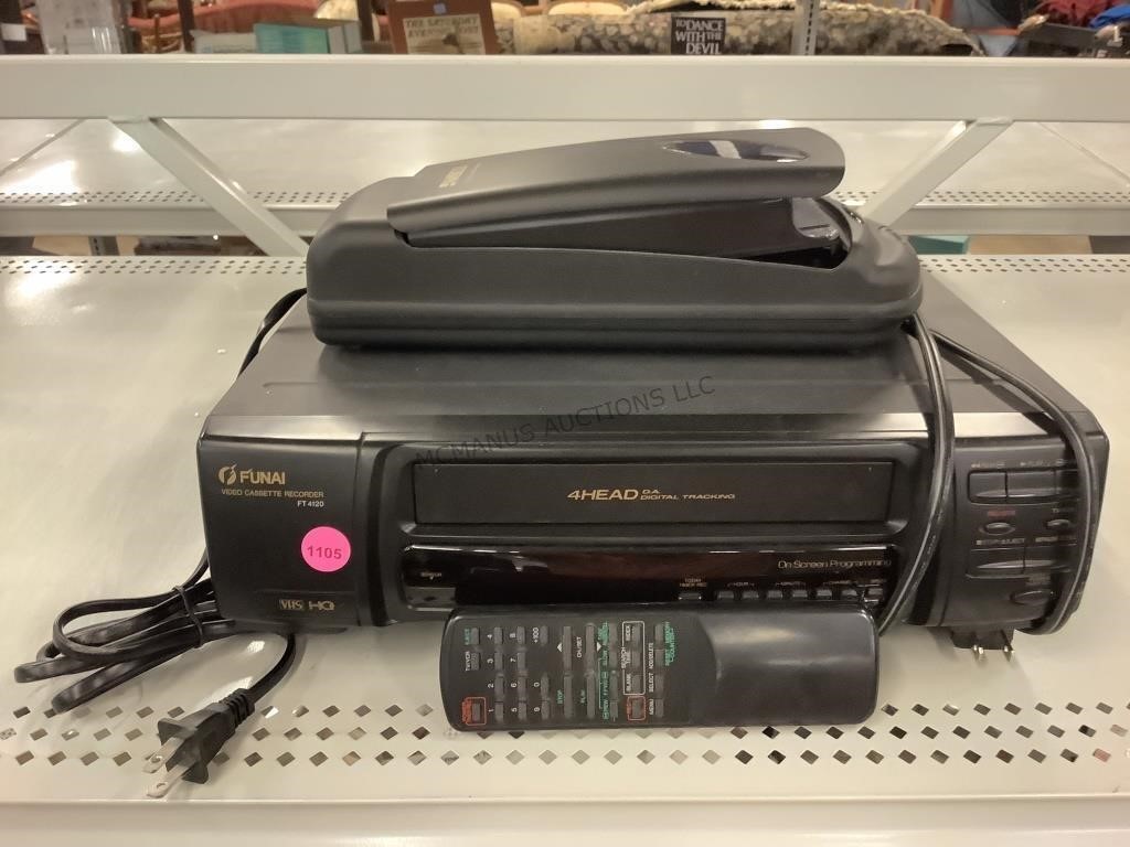 Funai VHS recorder with remote and VHS reminder.