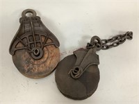 Two Cast Iron and Wood Pulleys