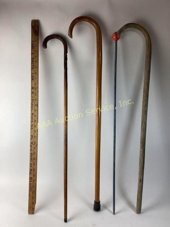 4 Wooden canes  1 thin hand carved wooden cane.