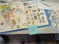 STAMP ALBUM WITH MANY STAMPS