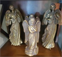 Shelf of 4 gold colored angels