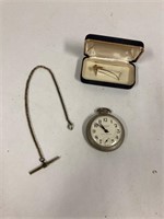Pocket watch with chain and a tie clip
