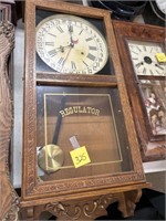 regulator clock with pendulum and key