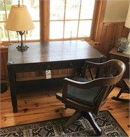 oak desk, office chair and iron lamp