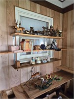 Items on shelves including music boxes and decor