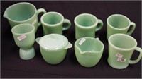 Eight pieces of Fire-King jadeite: mugs,