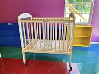 Commercial Crib on wheels; measures approx. 39 in