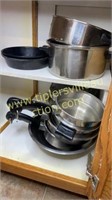 Corner cabinet of kitchen ware, pots and pans