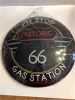 16 in round metal 66 button sign
