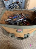 Tool bag full of hand tools,