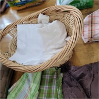 Basket of various pillow cases etc.