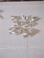 Set of 7 napkin rings made from flatware forks.