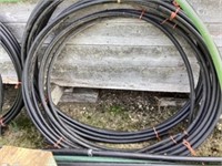 2 lengths of 1-1/4 hose and a length of green