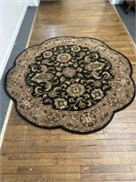 Black and tan round rug