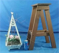 Plant stand with faux flower arrangement