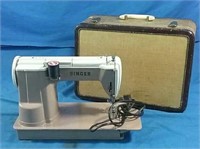Singer sewing machine with retro case