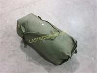 Duffle bag full of military clothing
