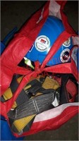 Bag with safety harness and helmet
