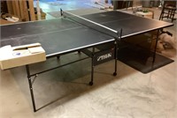 Stiga ping-pong table and accessories