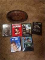 Assorted DVDs in wicker basket