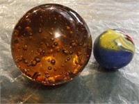 Glass paper weight and a large marble.