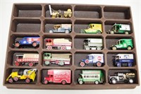 Display case of 16 model cars and trucks