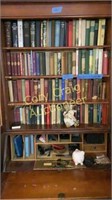 Books and contents of cabinet in middle bedroom