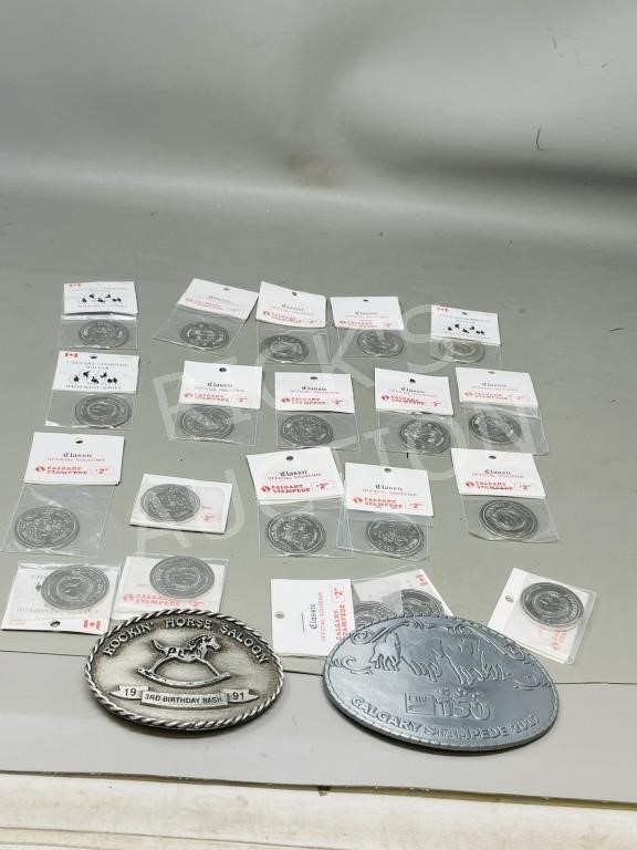 15 Stampede dollars & 2 collectable buckles