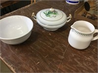Two ceramic bowls and one ceramic pitcher
