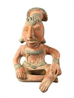 A Pre-Columbian Style Man With Headdress Sitting