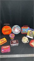 Various tins, vintage Pebbles and Bam Bam cups