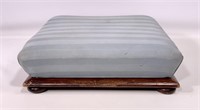 Low foot stool, molded base has a button foot,
