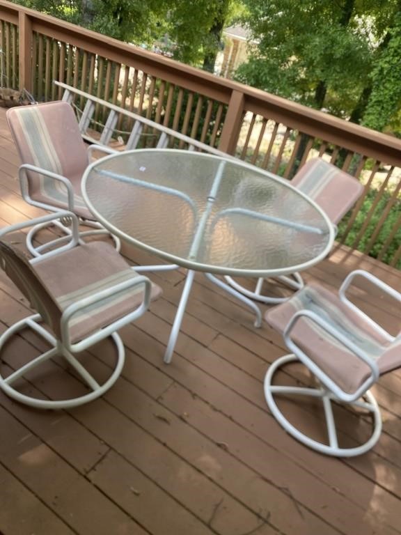 Glass top patio table w/four chairs. One chair