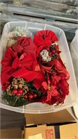 Red Christmas bows and decors in tote