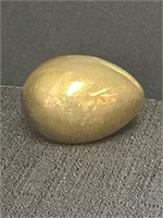 Brass egg paperweight, semi flat on one side