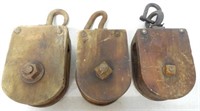 lot of 3 wooden pulleys possibly for hay trolleys