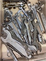 assorted wrenches including adjustable