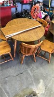 Approx 40” wooden round tablewith 5 chairs and 2