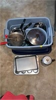 Tote with assorted pots and pans.