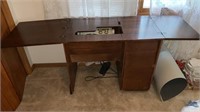 Vintage sewing table with vintage sewing machine