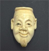 Antique Japanese carved ivory mans face netsuke