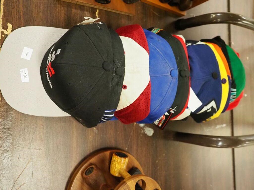 17 baseball-style caps, all NASCAR or