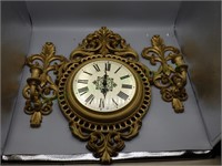 Decorative clock and wall sconces