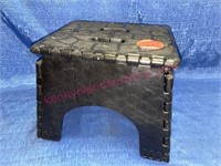 Black folding step stool (plastic)