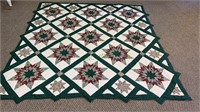 Vintage quilt bed coverlet with a star pattern -