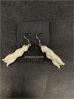 Pair of bone otter earrings on sterling silver hoo